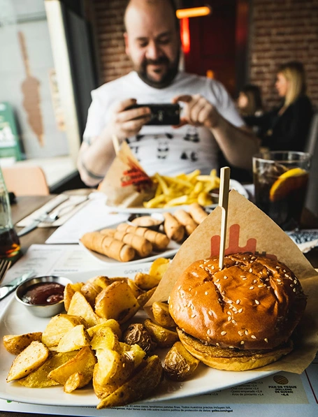 Chef preparing a fresh smashed burger